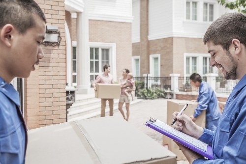 Local removals team handling a Greenwich home move with careful loading