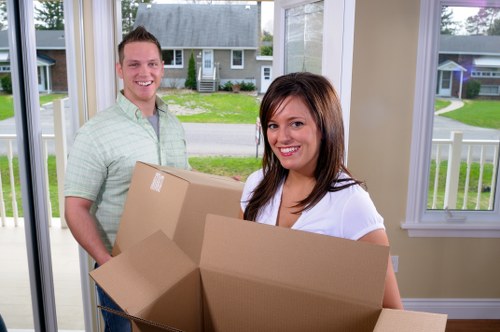 Team member loading furniture safely into a moving van