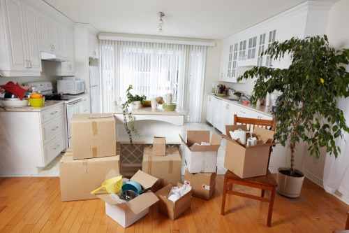 Removal team handling furniture in a Greenwich property