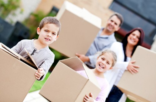 Careful unloading of household items into a Greenwich flat