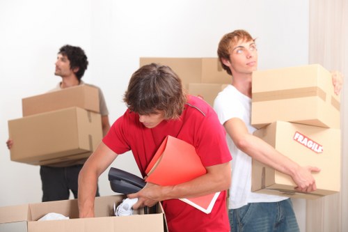 Professional movers loading items into a removal van in Greenwich