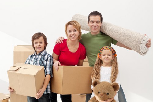 Professional mover handling belongings with safety precautions