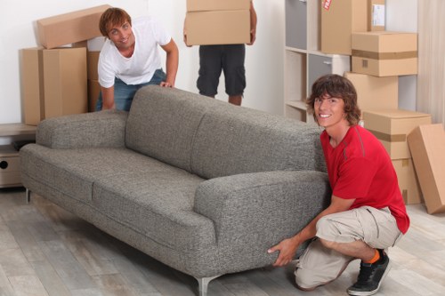 Boxes and furniture being loaded into a moving van