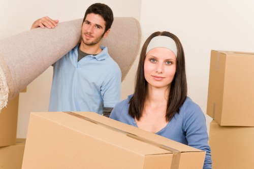 Professional moving team in Greenwich loading items into a van