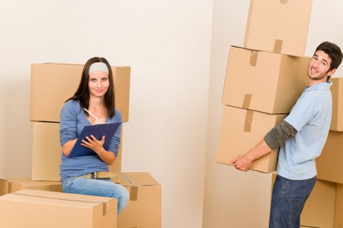 Loading household boxes into a moving van in Greenwich