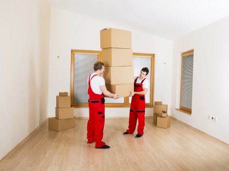Professional man and van team handling items carefully in Greenwich